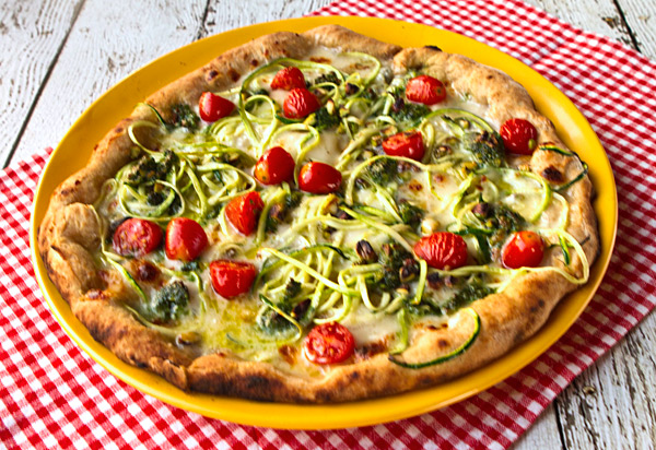 Pizza With Zucchini Spirals, Pistachio Pesto, Cherry Tomatoes, & Taleggio Cheese